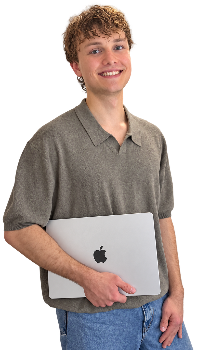 Nikolai Kruk holding a MacBook
